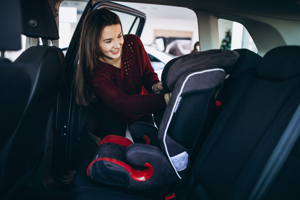 woman and the baby car seat